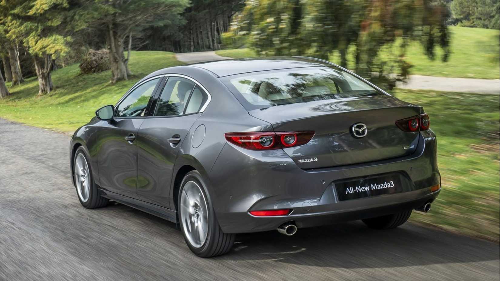 Dynamic rear 3/4 shot of a 2019 Mazda 3 Sedan.