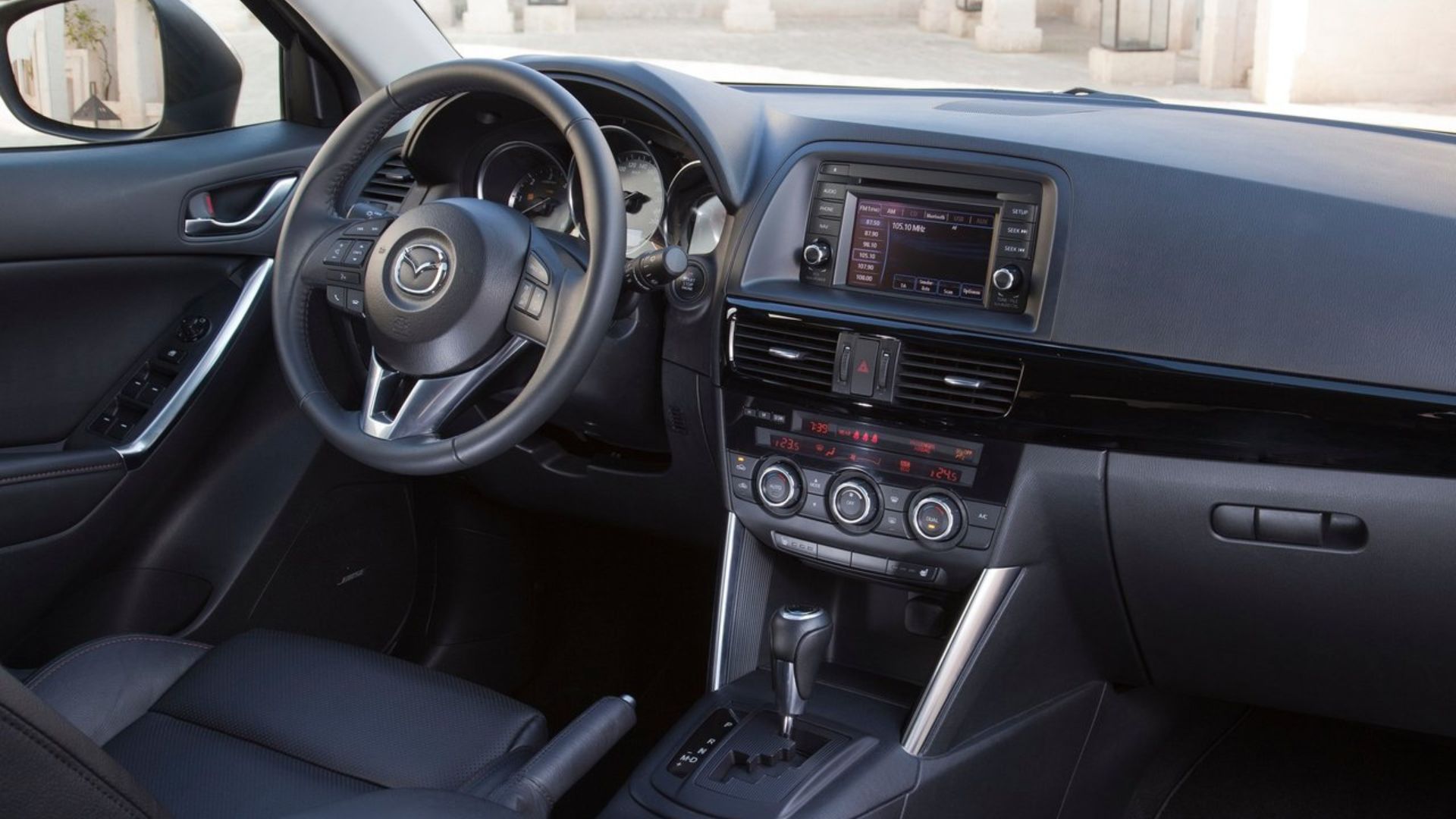 Shot of the dashboard inside the cabin of a 2013 Mazda CX-5.