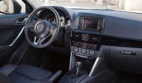 Shot of the dashboard inside the cabin of a 2013 Mazda CX-5.