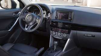 Shot of the dashboard inside the cabin of a 2013 Mazda CX-5.