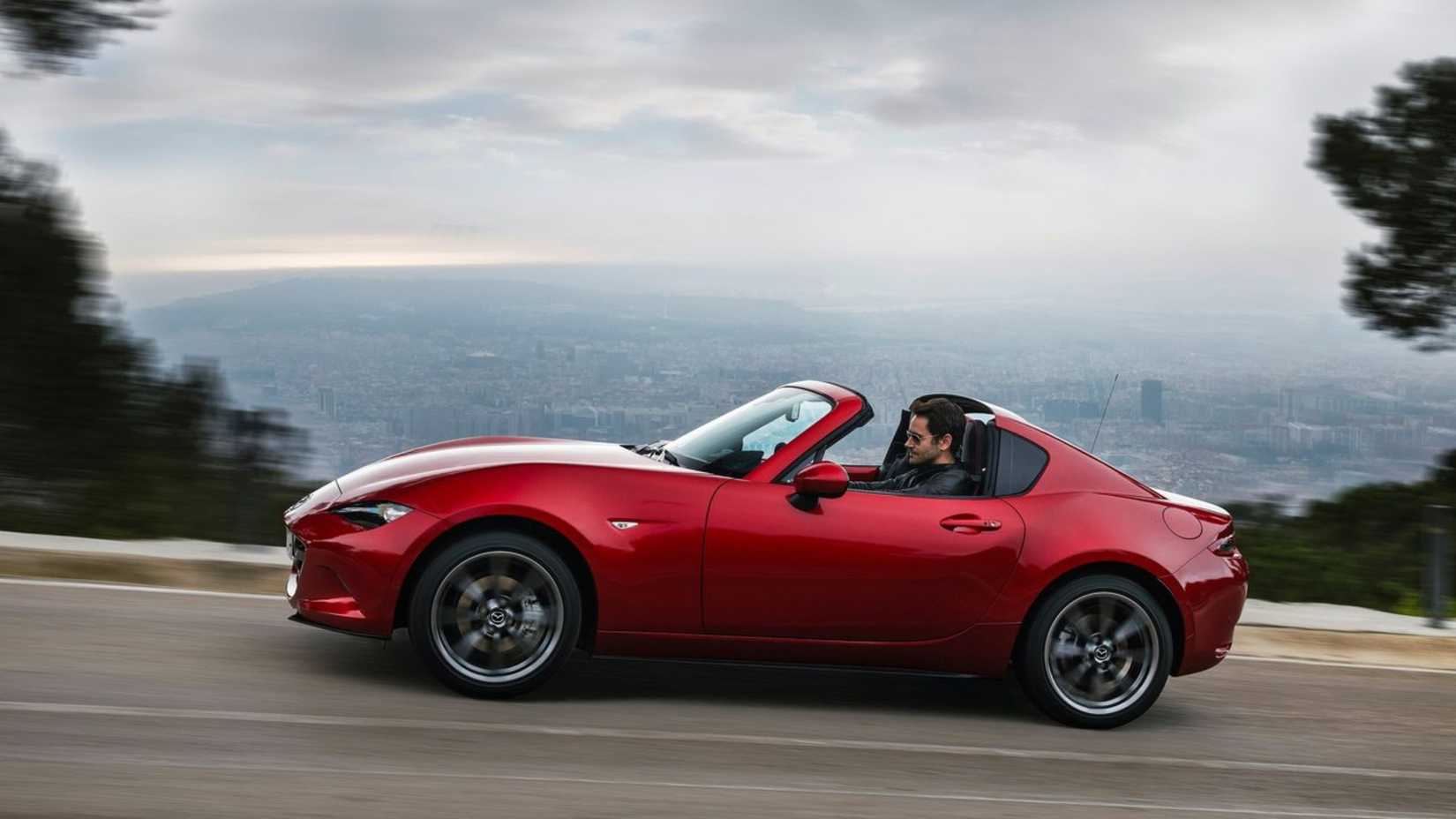 Dynamic side profile shot of a 2017 Mazda MX-5 RF.