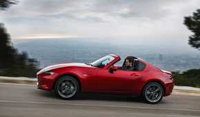 Dynamic side profile shot of a 2017 Mazda MX-5 RF.