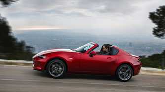 Dynamic side profile shot of a 2017 Mazda MX-5 RF.