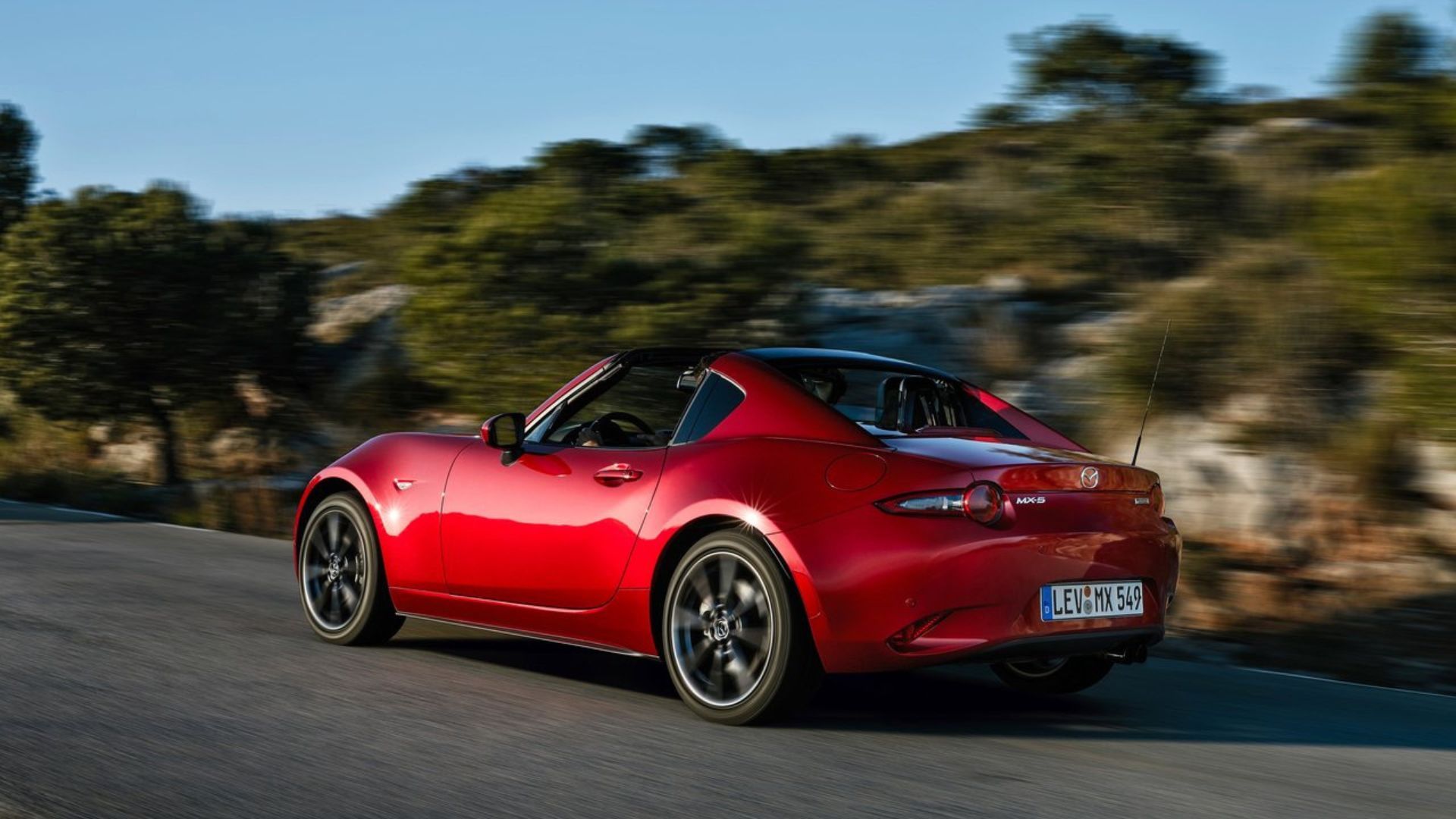 Dynamic rear 3/4 shot of a 2017 Mazda MX-5 RF.