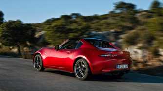 Dynamic rear 3/4 shot of a 2017 Mazda MX-5 RF.