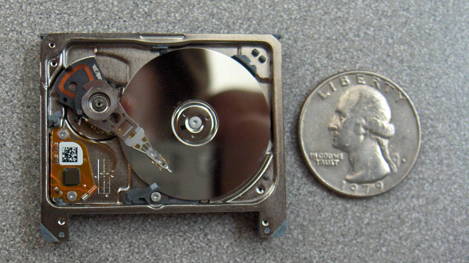 Seagate ST1 next to a quarter