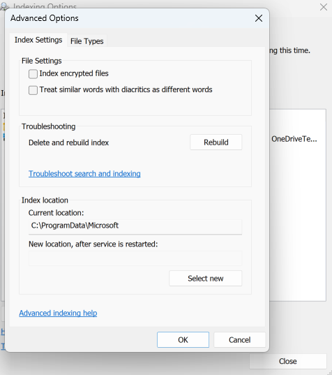 A screenshot of Windows 11 Settings open to the Privacy & security Search tab. The Indexing Options Advanced Options menu is open and the Rebuild button is in the troubleshooting section.