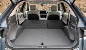 Shot of the open trunk of a 2022 Hyundai Ioniq 5 with the rear seats folded down