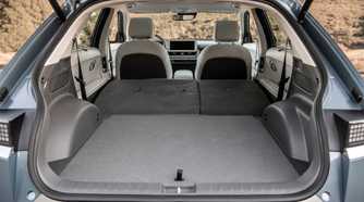 Shot of the open trunk of a 2022 Hyundai Ioniq 5 with the rear seats folded down