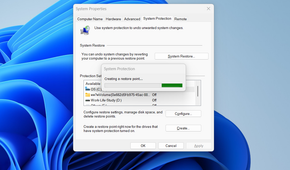 Creating a restore point on Windows via System Protection.