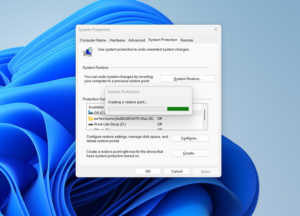 Creating a restore point on Windows via System Protection.