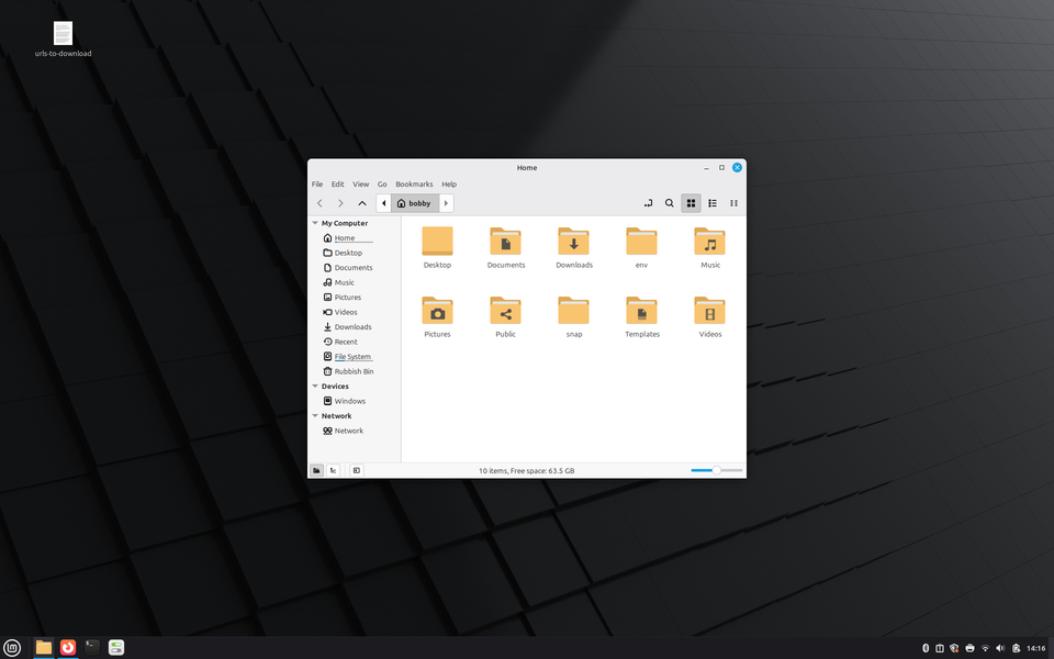Linux Mint with the Nemo app open showing the user’s home directory which includes directories such as Desktop, Downloads, and Videos.