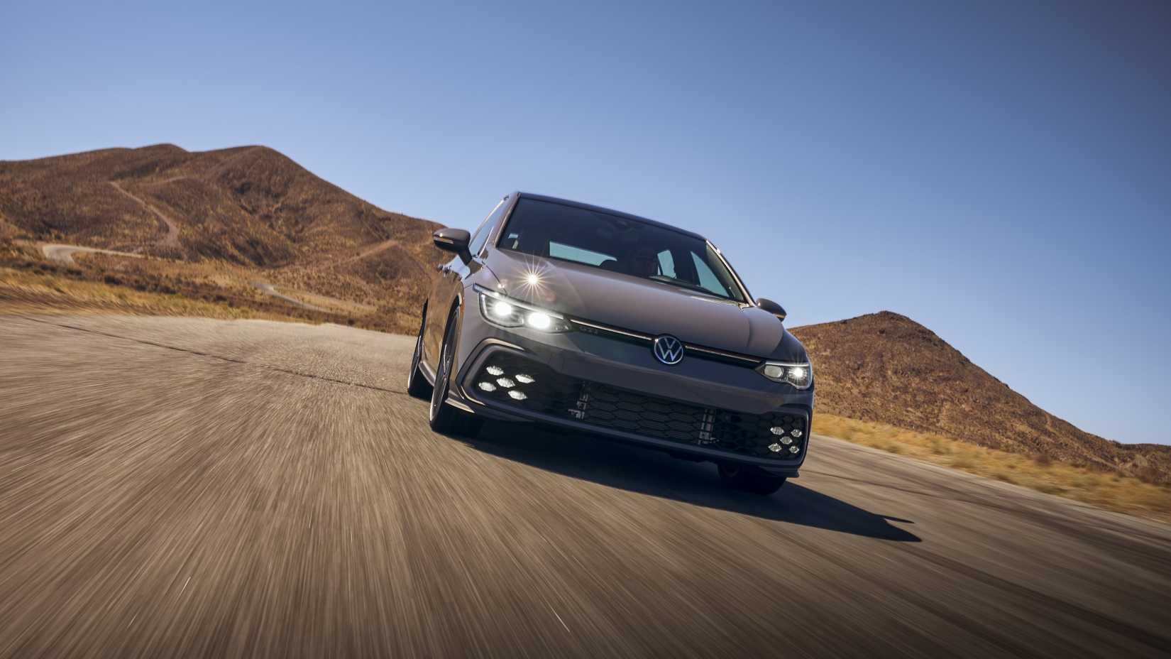 Head-on action shot of a 2022 Volkswagen Golf GTI