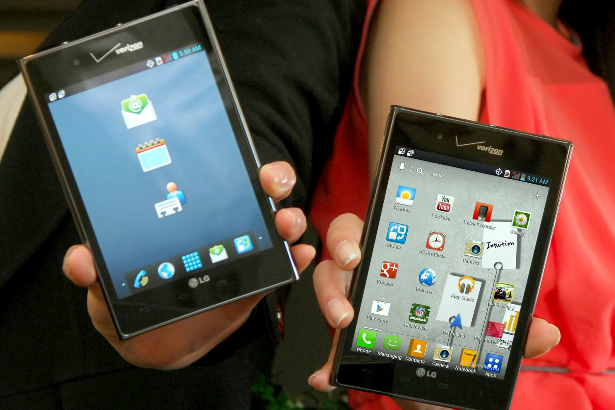 People holding the LG Optimus Vu