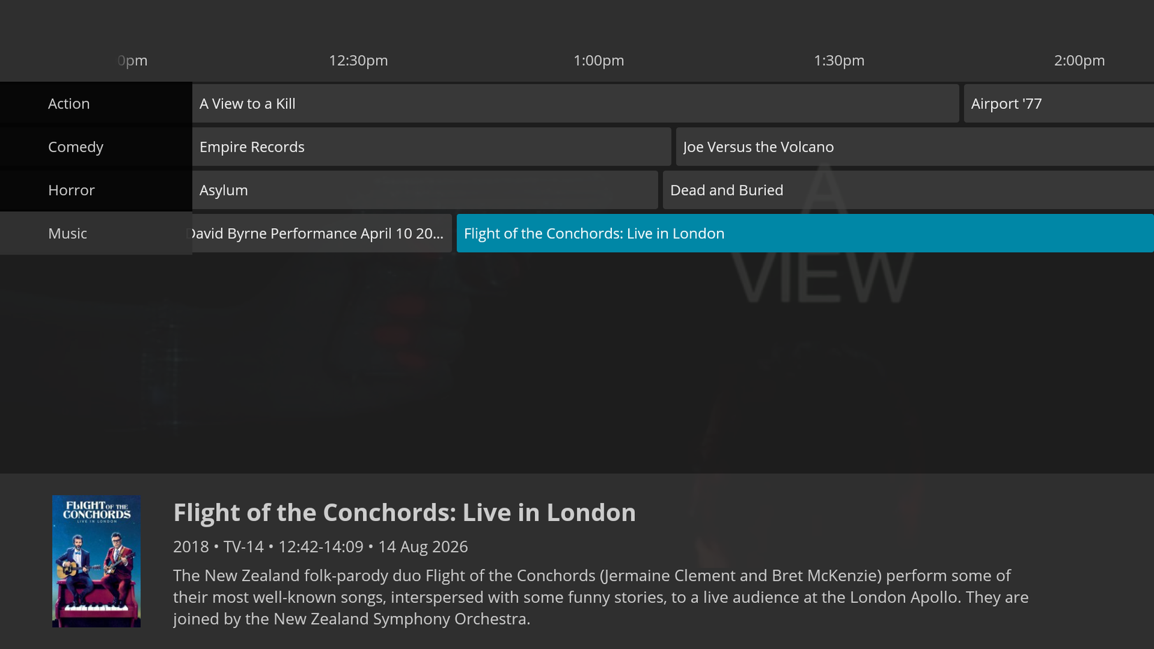 The QuasiTV app running on Fire TV showing mock TV listings.
