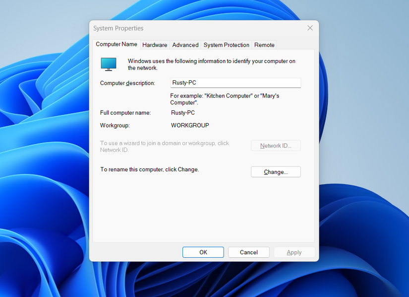 The System Properties window opened and displaying computer name and other information.