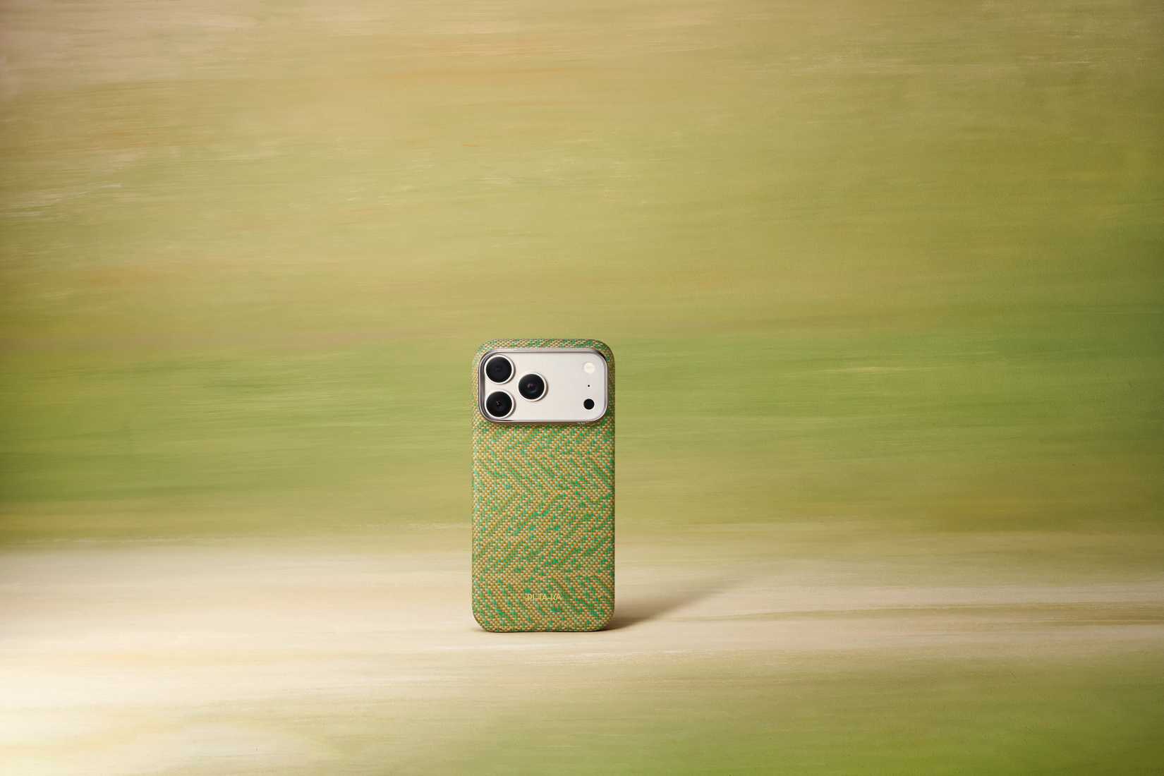 The PITAKA EDGE case with a Wind Over Wheat pattern in green on a green background.