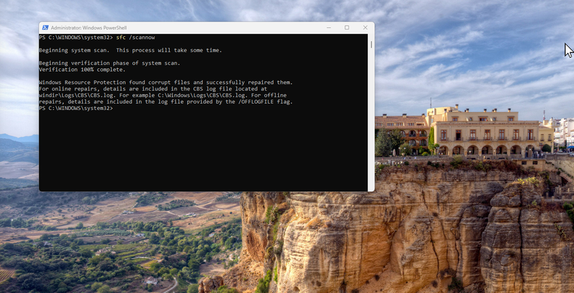 PowerShell shows System File Checker completing a scan and reporting that it found and successfully repaired corrupted Windows files.