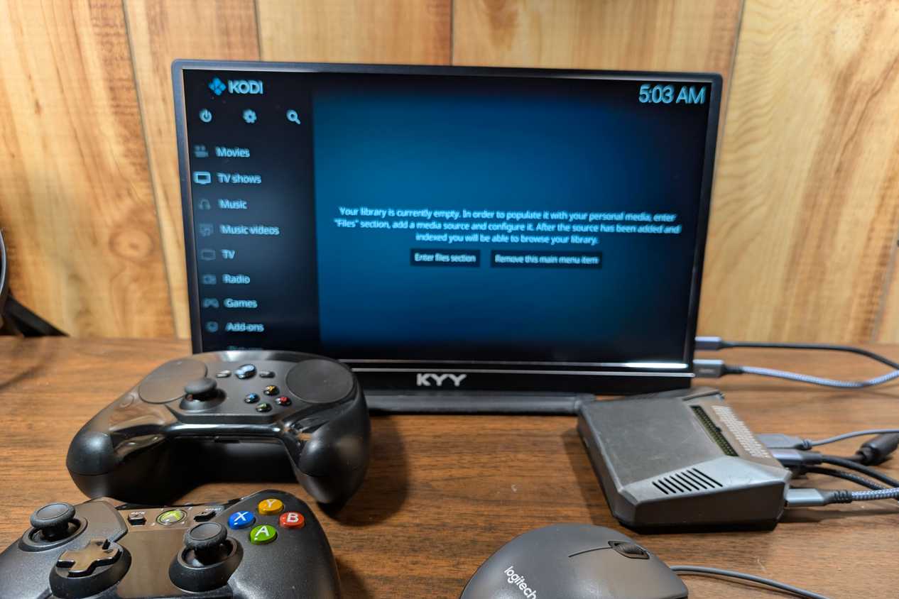 A mix of input methods on a desk with a Pi running LibreELEC.