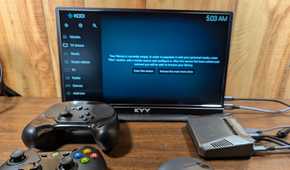 A mix of input methods on a desk with a Pi running LibreELEC.