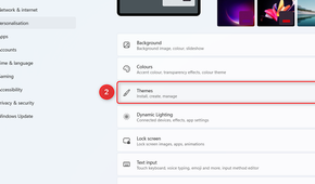 The Themes option is highlighted under the Personalization menu in Windows 11 Settings.