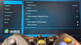 An XBOX controller in the foreground with LibreELEC in the background.