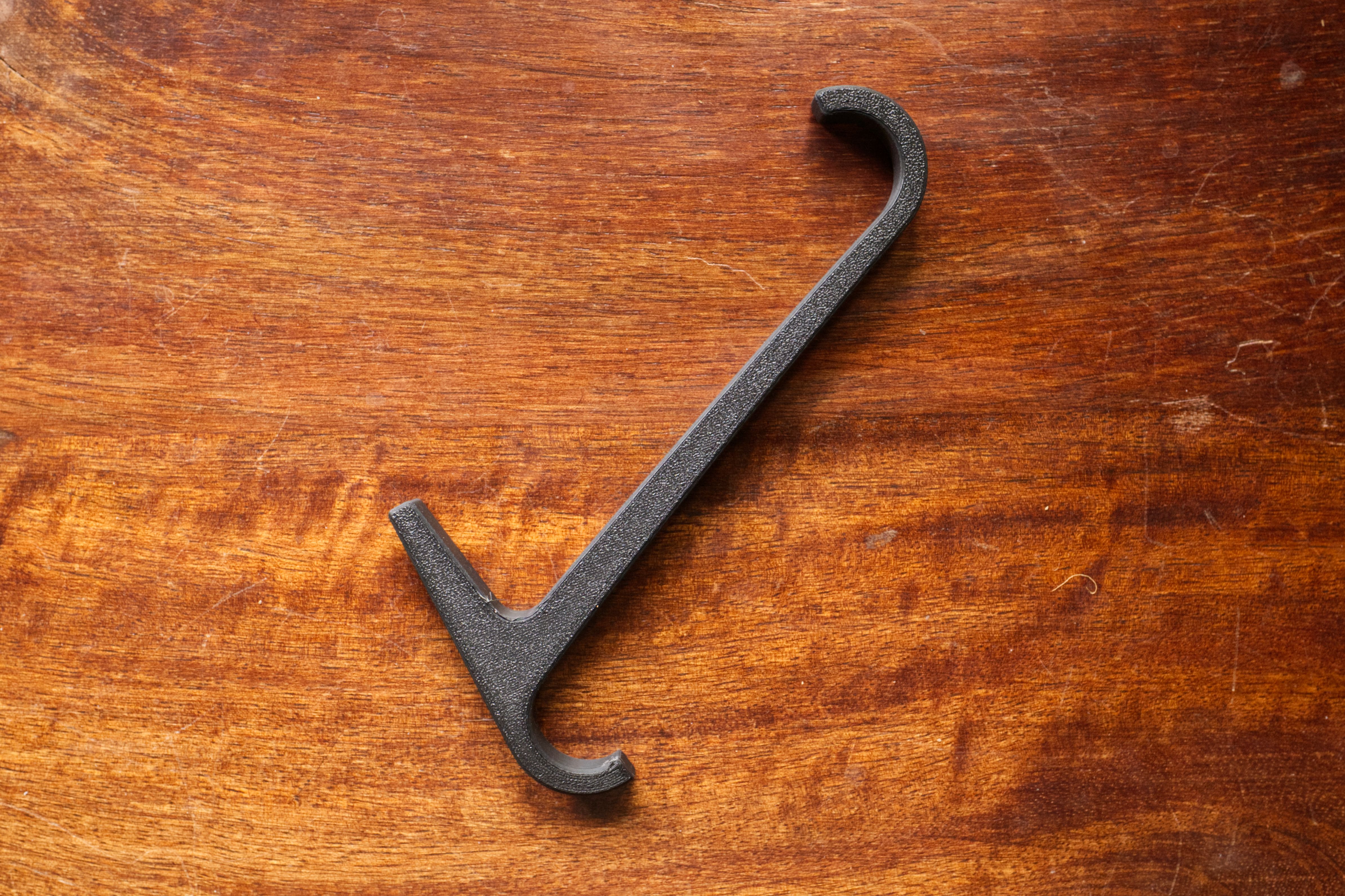 3D printed towel rail hook on a table.