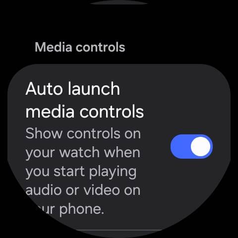 Galaxy Watch settings screen showing the “Auto launch media controls” option enabled, allowing media controls to appear automatically when audio or video plays on the connected phone.