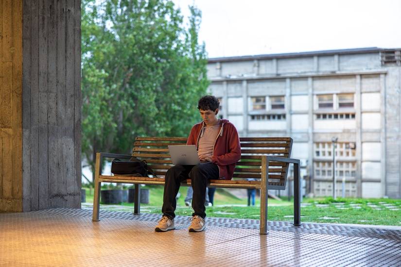 Man working on the Dell XPS 13 on a bench.