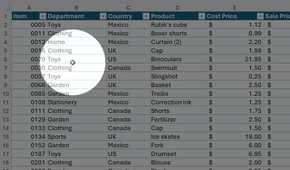 Find My Mouse PowerToys feature highlights a cursor over an Excel table.