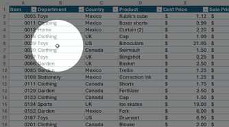 Find My Mouse PowerToys feature highlights a cursor over an Excel table.