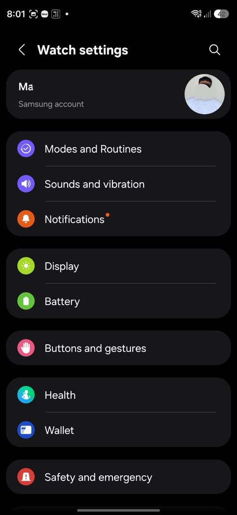 Samsung Galaxy Wearable app displaying Galaxy Watch settings, including Modes and Routines, Sounds and vibration, Notifications, Display, Battery, Buttons and gestures, Health, Wallet, and Safety and emergency.