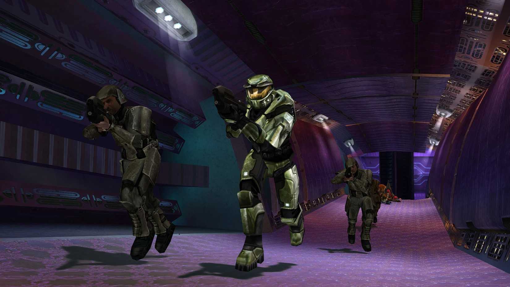 Promotional image for Halo: Combat Evolved showing Master Chief running towards the screen. 