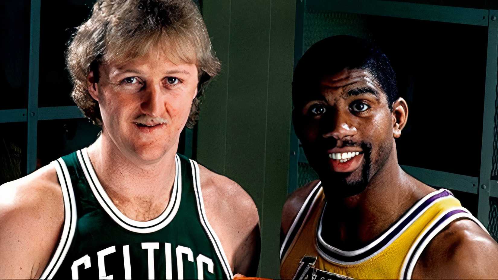 Larry Bird and Magic Johnson smile for the photo.