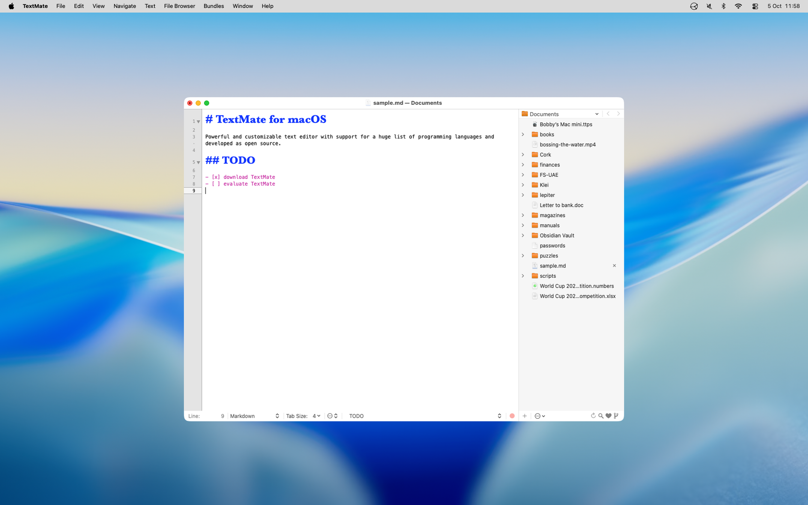 The TextMate app showing an open Markdown document with inline syntax and formatting.