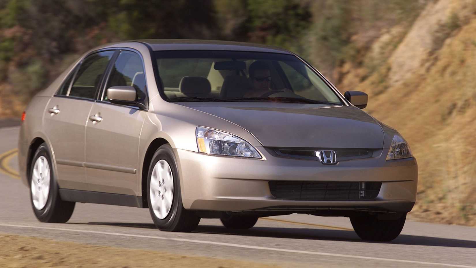 A front three-quarter shot of a 2003-2005 Honda Accord Sedan driving