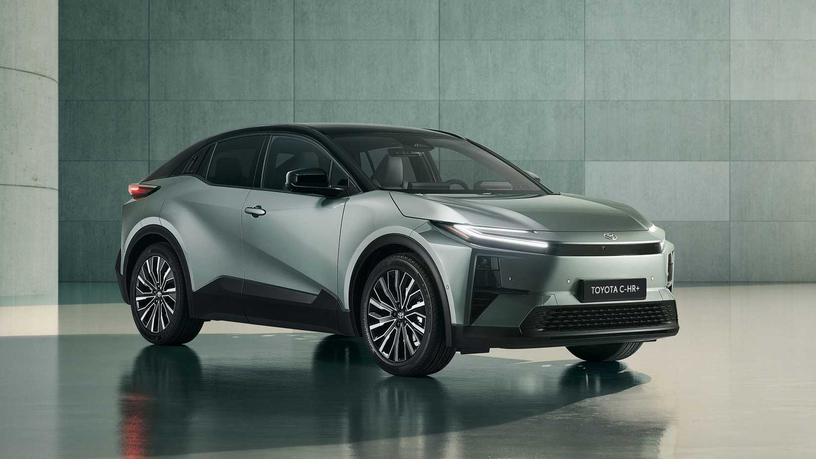 Static front 3/4 shot of a silver 2026 Toyota C-HR+ Electric Crossover.