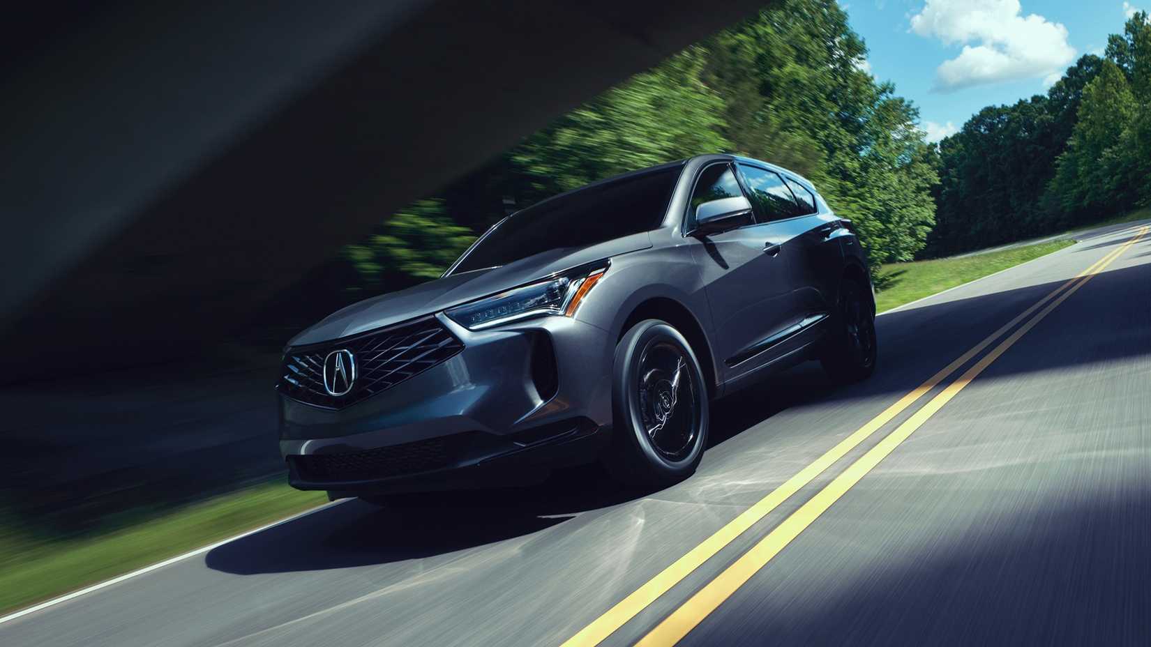 Dynamic front 3/4 shot of a gray 2025 Acura RDX.