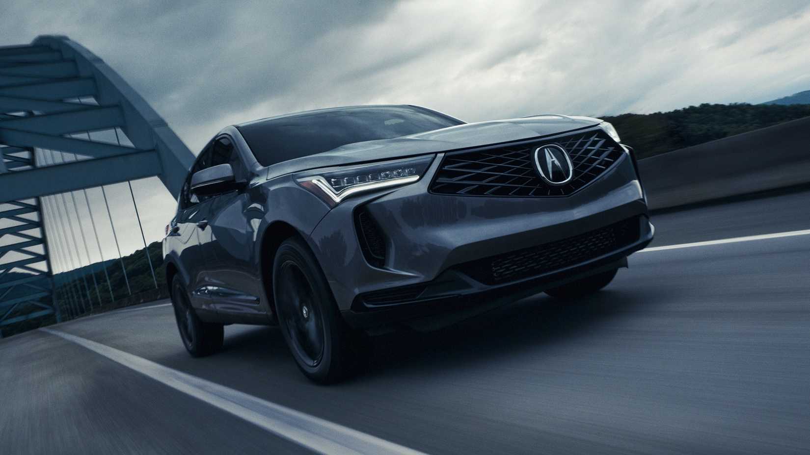 Dynamic front 3/4 shot of a gray 2025 Acura RDX.