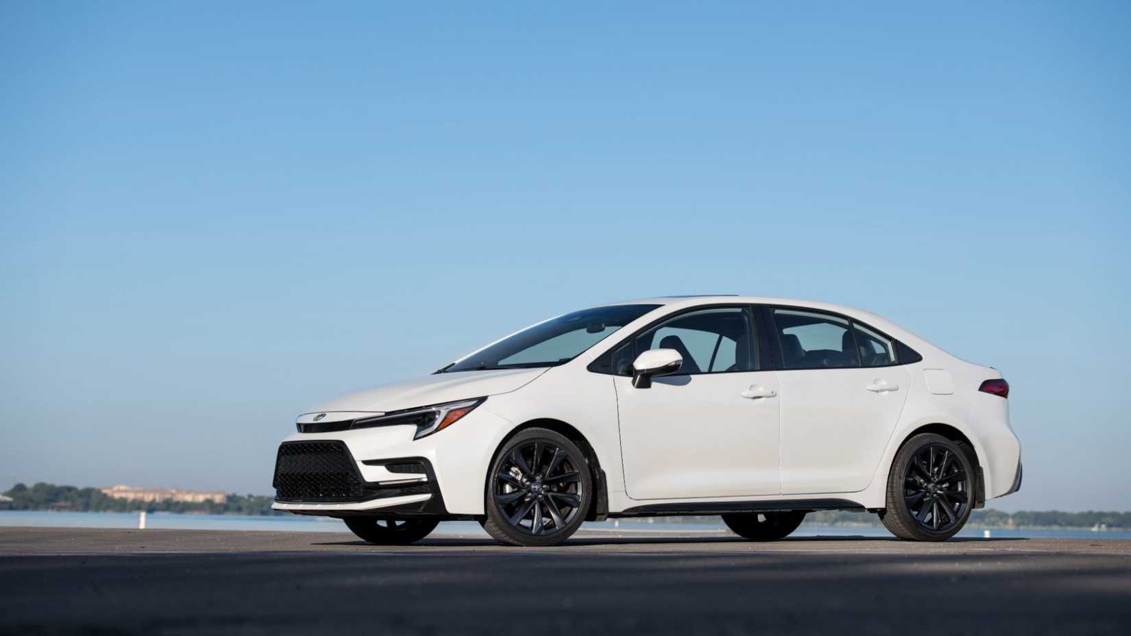 Static front 3/4 shot of a whiet 2026 Toyota Corolla Sedan.