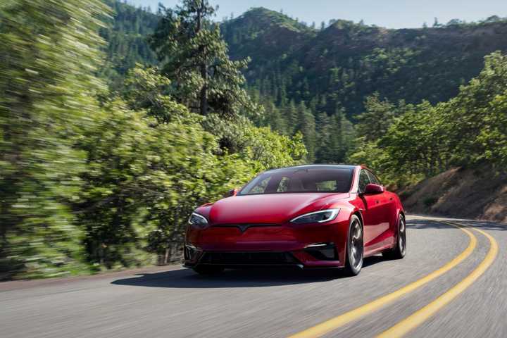 Front 3/4 action shot of a 2021 Tesla Model S