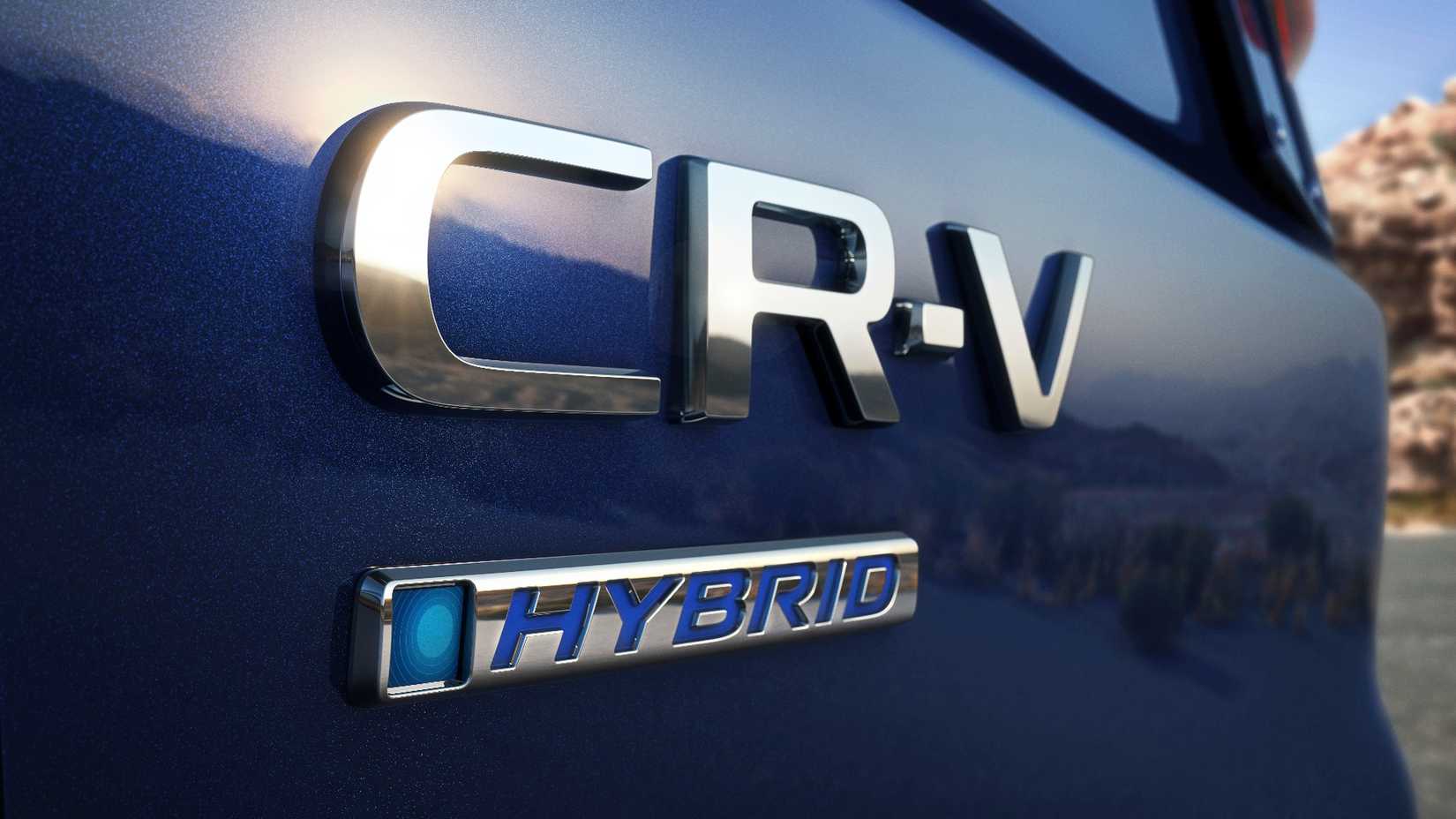 Close-up shot of the badging on the trunk lid of a blue 2023–2025 Honda CR-V Hybrid.