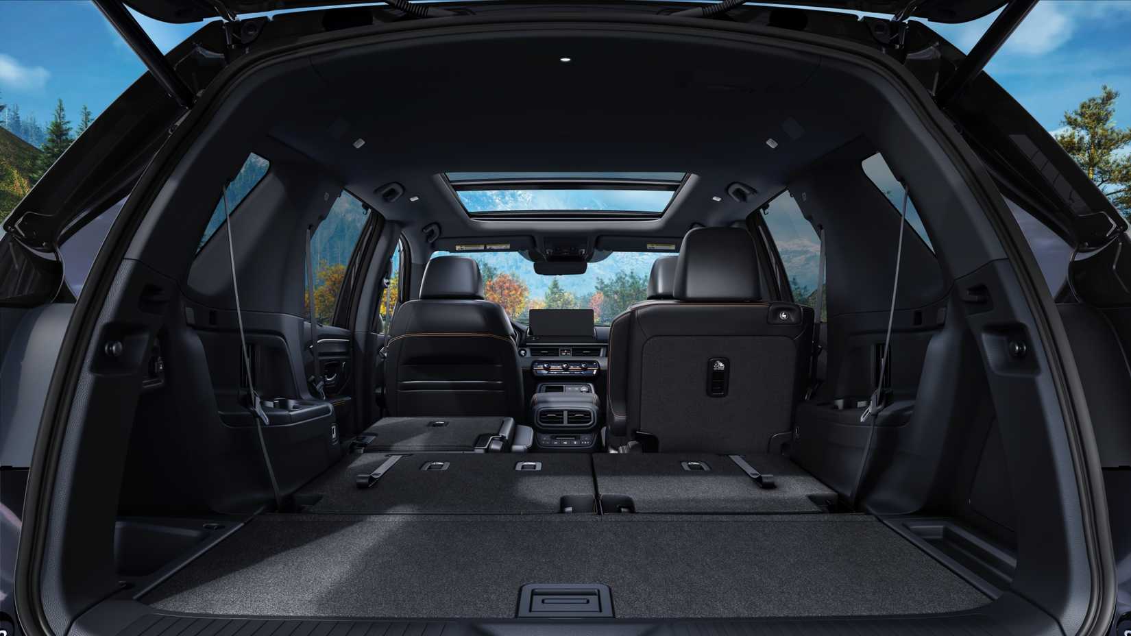 Shot inside the trunk of a 2026 Honda Pilot TrailSport, showing the space with the rear seats folded.