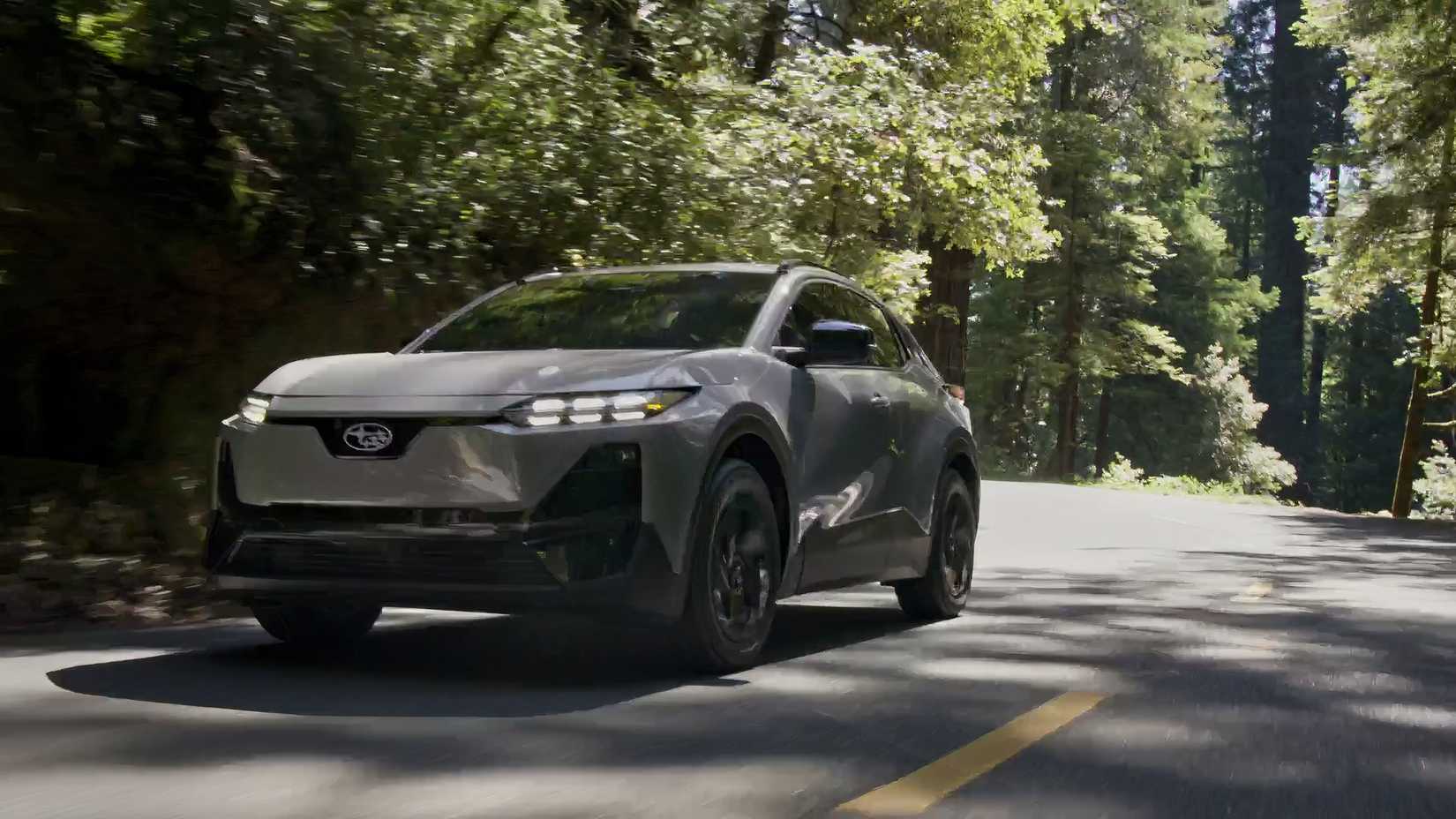 Dynamic front 3/4 shot of a gray 2026 Subaru Uncharted. 