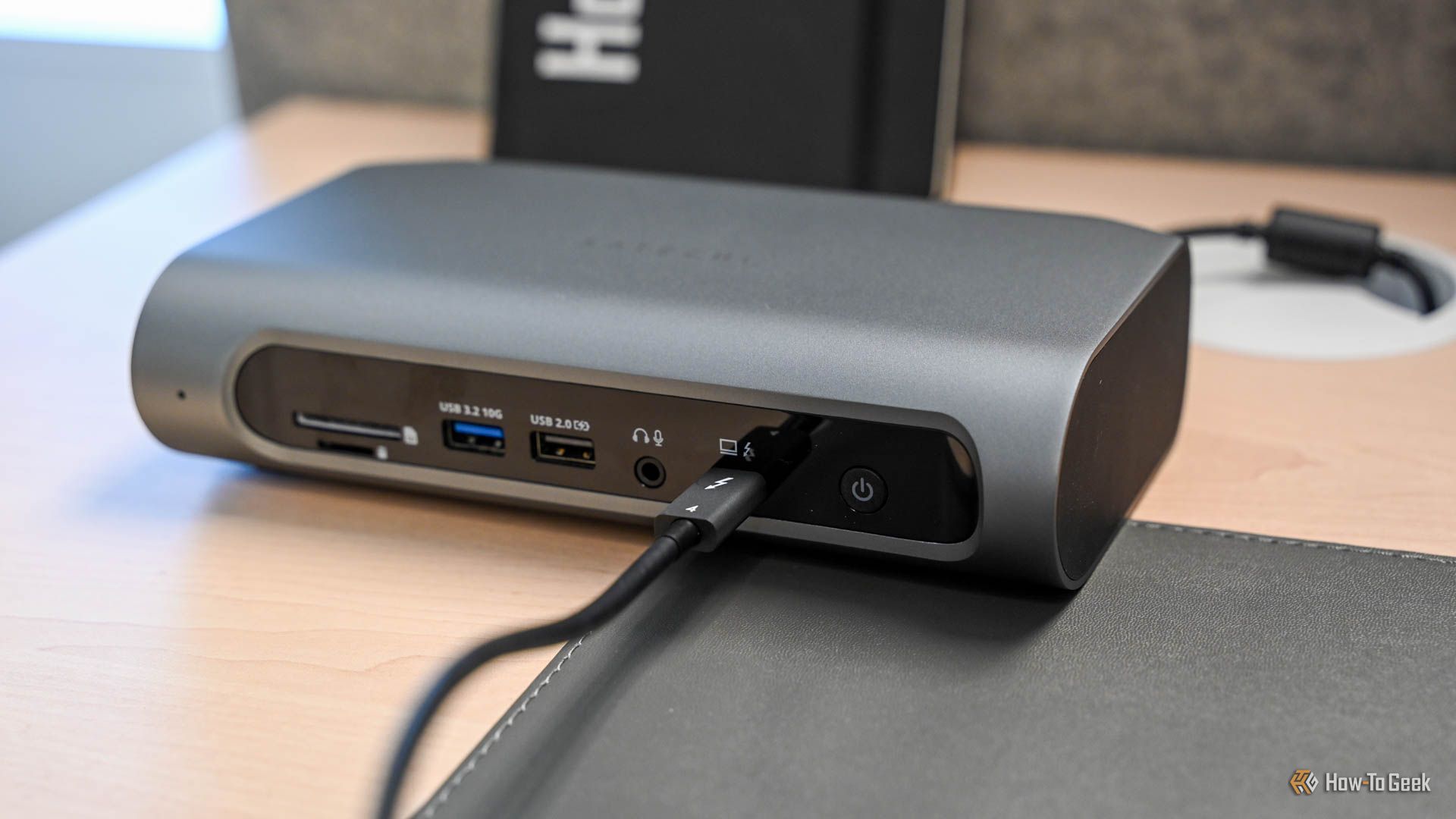 A Thunderbolt cable plugged into the Satechi Thunderbolt 4 Multimedia Pro Dock.