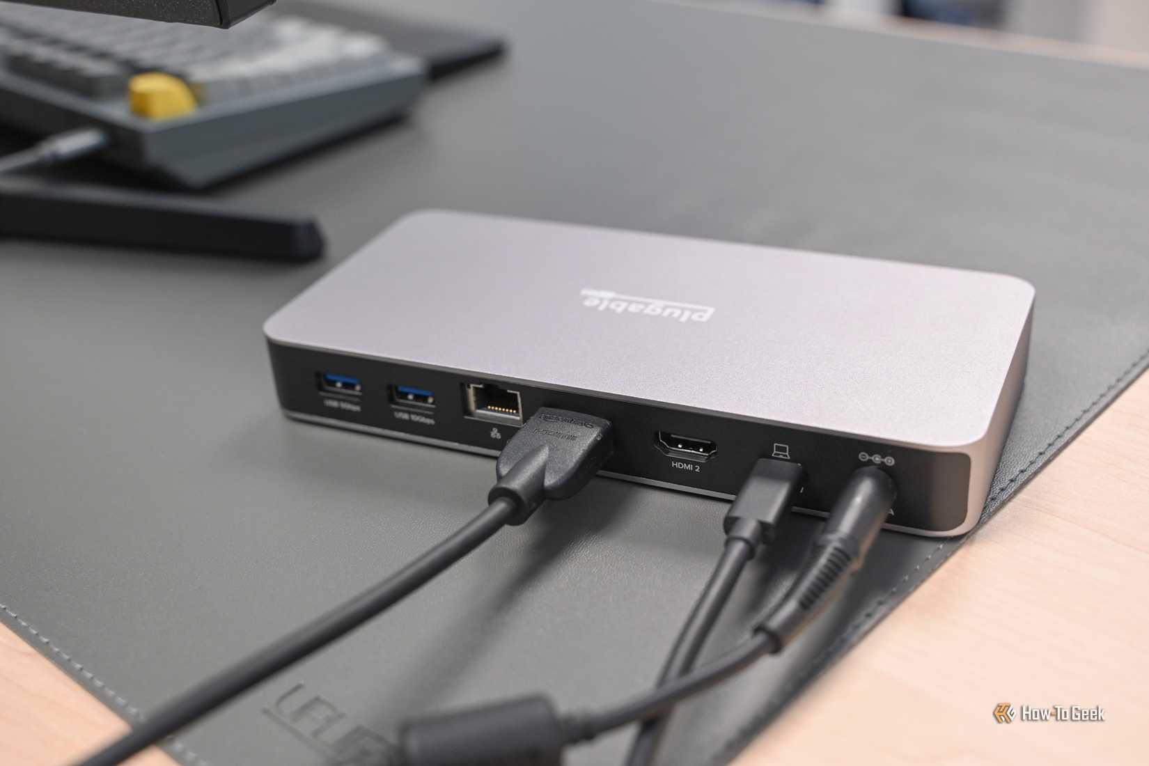Cables plugged into the rear of the Plugable USB4 Dual HDMI Docking Station. 