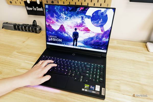 Hand on the keyboard of the Lenovo Legion 9i.