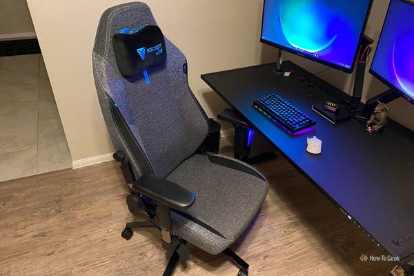 Secretlab TITAN Evo SoftWeave Hero next to Secretlab adjustable desk