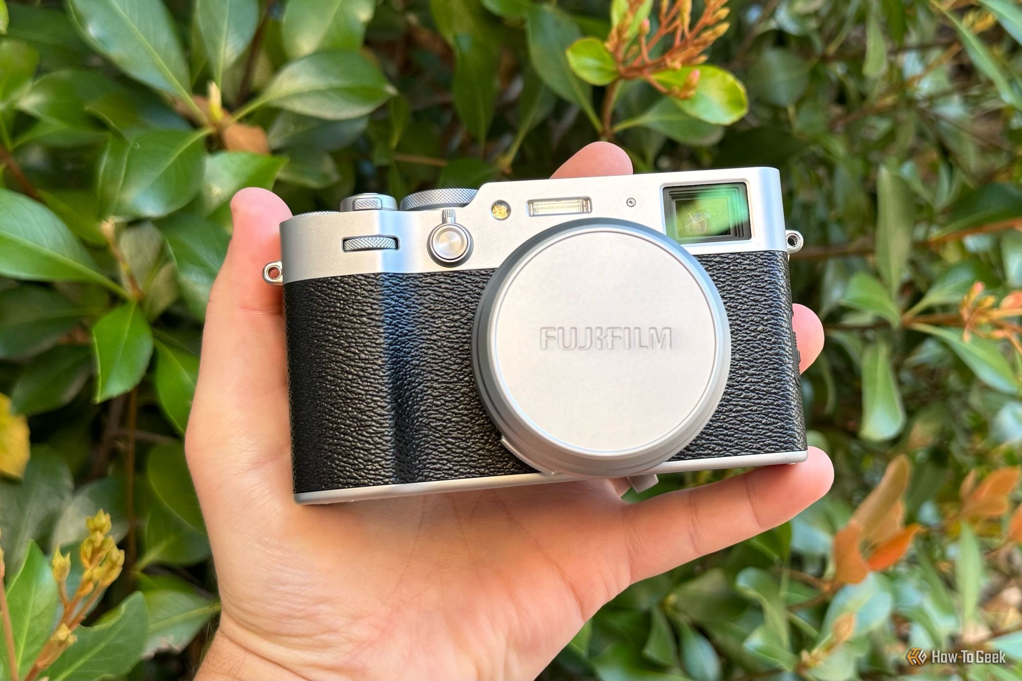 person holding the Fujifilm X100VI camera in their hand