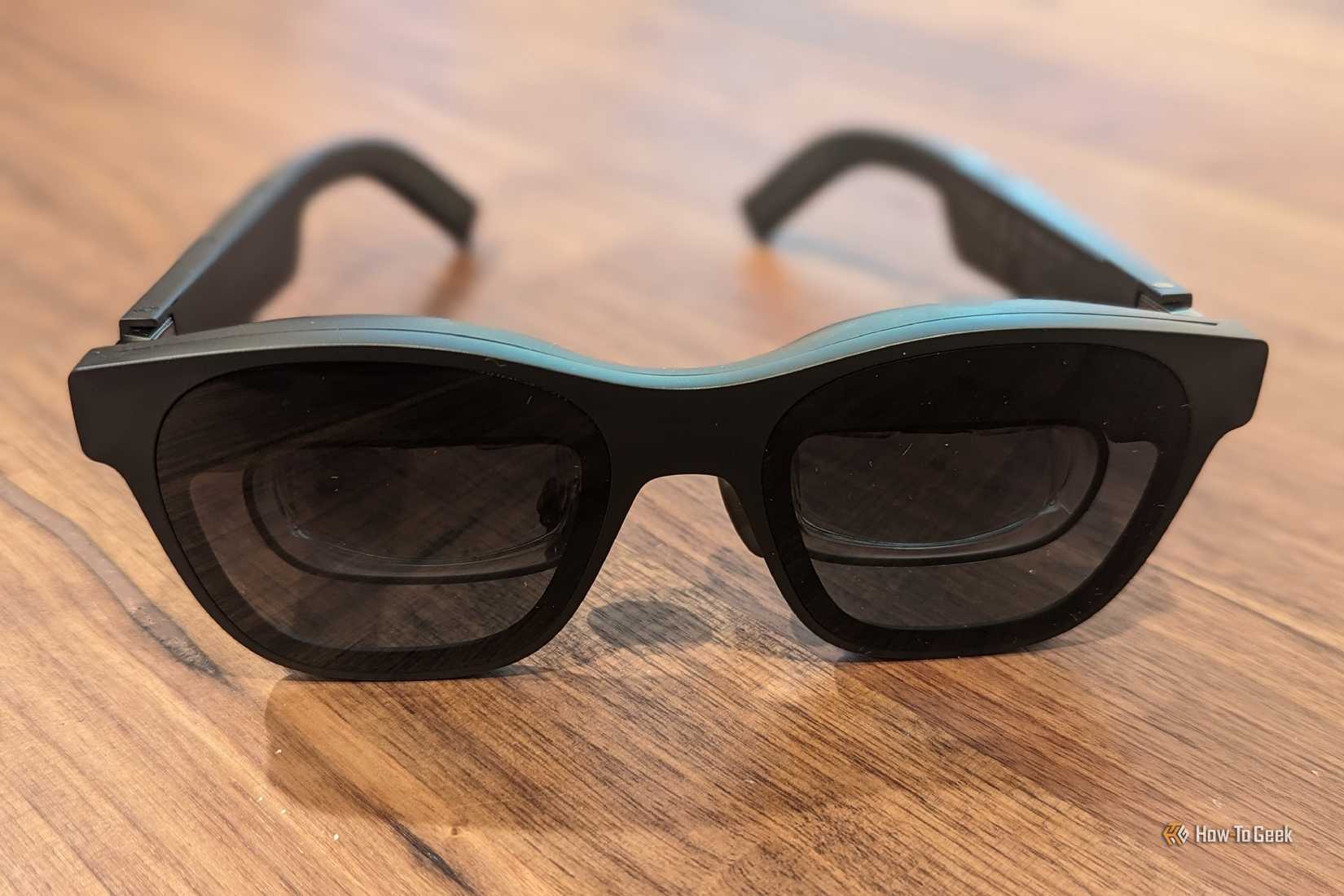 XREAL Air 2 Pro AR glasses placed on a desk.